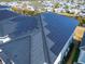Aerial shot of solar panels covering the roof of a residential building, promoting sustainable energy at 6536 Simone Shores Cir, Apollo Beach, FL 33572