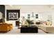 Open-concept living room with modern furnishings, a large sofa, and bright, natural light at 6841 E 115Th St, Palmetto, FL 34221