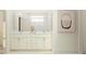 Elegant bathroom with a double vanity, marble countertop, and modern fixtures at 7529 E 116Th St, Palmetto, FL 34221