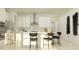 Bright modern kitchen featuring stainless steel appliances, white cabinets, and breakfast bar seating at 7529 E 116Th St, Palmetto, FL 34221