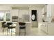 Modern kitchen featuring white cabinetry, stainless steel appliances, and a center island with bar seating at 7529 E 116Th St, Palmetto, FL 34221