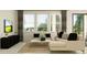 Cozy living room featuring a comfortable sectional sofa, large windows, and modern decor at 7529 E 116Th St, Palmetto, FL 34221