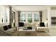 Bright living room with large windows, stylish furnishings, and an open-concept design at 7529 E 116Th St, Palmetto, FL 34221