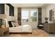 Relaxing main bedroom with a stylish bed, large windows, and coordinated decor at 7529 E 116Th St, Palmetto, FL 34221