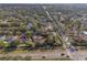 Aerial shot of the property highlighting its prime location near the highway, and neighborhood amenities at 10098 Oaks Ln, Seminole, FL 33772