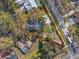 An aerial view shows the property's layout, including the pool, driveway, and well-maintained landscaping at 10098 Oaks Ln, Seminole, FL 33772