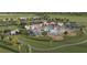 An aerial of community pool with ample seating, playground, and surrounding landscaped grounds at 1134 Kistna Dr, Zephyrhills, FL 33540