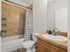 Full bathroom with a shower-tub combo, vanity, and modern fixtures at 1211 E Giddens Ave, Tampa, FL 33603