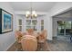 Dining room with views of the water and access to the living room at 12141 Arron Ter, Trinity, FL 34655