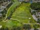 Aerial view of lush golf course, fairways, and manicured greenery at 12141 Arron Ter, Trinity, FL 34655