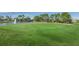 Beautiful golf course featuring a serene lake and manicured green at 12141 Arron Ter, Trinity, FL 34655