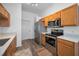 Well-lit kitchen featuring modern appliances and marble countertops at 12141 Arron Ter, Trinity, FL 34655