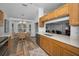 Bright kitchen with stainless steel appliances and wood cabinets at 12141 Arron Ter, Trinity, FL 34655