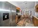 Bright kitchen and breakfast nook with stainless steel appliances and wood cabinetry at 12141 Arron Ter, Trinity, FL 34655