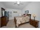 Bright main bedroom featuring wood furniture and a ceiling fan at 12141 Arron Ter, Trinity, FL 34655