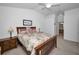 Main bedroom boasts neutral walls and a view into the ensuite bathroom at 12141 Arron Ter, Trinity, FL 34655