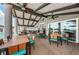 Inviting outdoor dining area with tables and chairs under a covered patio with ceiling fans at 12141 Arron Ter, Trinity, FL 34655