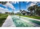 Outdoor shuffleboard courts with a pavilion in the background, perfect for community fun at 12141 Arron Ter, Trinity, FL 34655