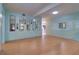 Living room with light wood floors and light blue walls at 1235 45Th N St, St Petersburg, FL 33713