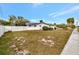 Large backyard enclosed by a white fence, perfect for privacy and outdoor activities at 14005 Leeward Dr, Seminole, FL 33776