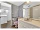 Bathroom featuring a vanity with a pink sink and toilet, plus a connected laundry room at 14005 Leeward Dr, Seminole, FL 33776