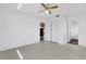 Bedroom featuring an all-white interior, ceiling fan, and closet at 14005 Leeward Dr, Seminole, FL 33776