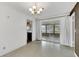 Light filled dining room with vintage lighting fixture and sliding glass doors at 14005 Leeward Dr, Seminole, FL 33776