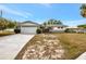 Charming single-story home with a spacious two-car garage and well-maintained front yard at 14005 Leeward Dr, Seminole, FL 33776