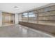 Bright Florida Room featuring paneled walls, many windows, and a sliding door to another room at 14005 Leeward Dr, Seminole, FL 33776