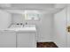 Laundry room with white washer and dryer at 14005 Leeward Dr, Seminole, FL 33776