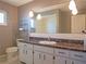 Bathroom features a white sink, a marble countertop, and decorative lighting at 1436 Rose St, Clearwater, FL 33756