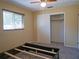 Bedroom featuring carpet, a window, and a closet with sliding doors at 1436 Rose St, Clearwater, FL 33756