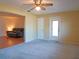 Bedroom with neutral carpet, an open doorway to the living room, and access to the rear of the home at 1436 Rose St, Clearwater, FL 33756