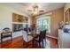 Inviting dining room with a glass table, modern chairs, and a window view at 1509 Ventana Dr, Sun City Center, FL 33573