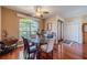 Dining room features a glass table with modern chairs and a bright window at 1509 Ventana Dr, Sun City Center, FL 33573