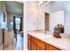 Simple bathroom with a single sink and a view into a bedroom at 18531 Lithia Ranch Rd, Lithia, FL 33547