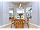 Charming breakfast nook with a round table and three chairs, near patio doors at 18531 Lithia Ranch Rd, Lithia, FL 33547