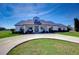 Front view of a charming house with a circular driveway at 18531 Lithia Ranch Rd, Lithia, FL 33547