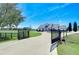 Home with gated entrance and circular driveway at 18531 Lithia Ranch Rd, Lithia, FL 33547