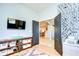 Bright home office with built-in shelving and a view of the kitchen at 18531 Lithia Ranch Rd, Lithia, FL 33547