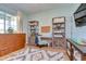 Functional home office with built-in shelving and a desk at 18531 Lithia Ranch Rd, Lithia, FL 33547