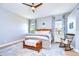 Relaxing main bedroom with a king-size bed and wood floors at 18531 Lithia Ranch Rd, Lithia, FL 33547