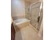 Bathroom features a separate tub and glass-enclosed shower at 21031 Sunpoint Way # 202, Lutz, FL 33558