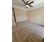 Bedroom with neutral carpet, ceiling fan, and a double-door closet at 21031 Sunpoint Way # 202, Lutz, FL 33558