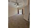 A spacious bedroom with carpet floors and access to a private balcony at 21031 Sunpoint Way # 202, Lutz, FL 33558