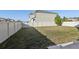 The backyard is enclosed by a white fence, providing privacy and a sense of security at 2604 Knight Island Dr, Brandon, FL 33511