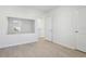 Bright bedroom featuring sleek floors and a large mirror at 2604 Knight Island Dr, Brandon, FL 33511