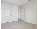 Bedroom with hardwood floors, large closet and a double door entryway at 2604 Knight Island Dr, Brandon, FL 33511