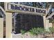 A stacked stone water feature displays the community name, Brooker Ridge, in bold lettering at 2604 Knight Island Dr, Brandon, FL 33511