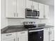 Kitchen closeup featuring stainless steel oven, range and custom cabinets at 2604 Knight Island Dr, Brandon, FL 33511